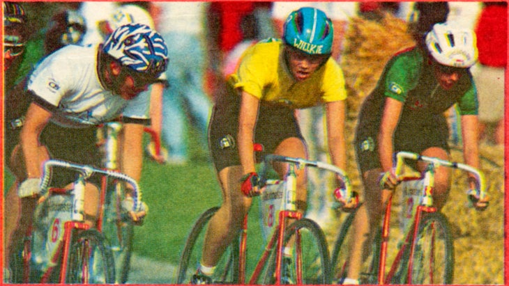 Three cyclists race during the women’s Little 500. One wears a helmet that says Willkie.”