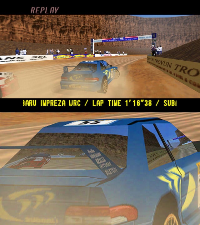 This N64 racing game has window reflections that actually show what's off screen, removing the need for a look back button. Game's pretty fun too.